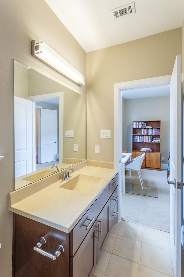 bathroom with tile patterned floors and vanity