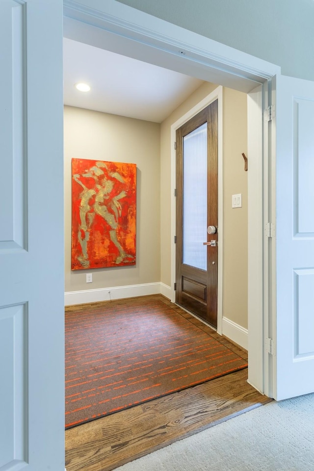 foyer entrance with hardwood / wood-style floors