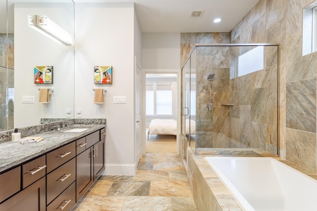 bathroom featuring independent shower and bath and vanity