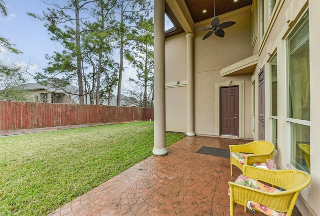 view of patio / terrace with a fenced backyard and ceiling fan