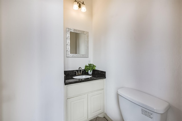 half bath with vanity and toilet