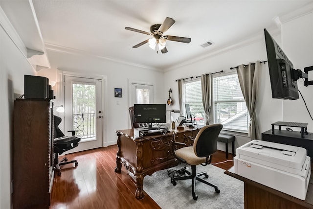 office with crown molding, visible vents, ceiling fan, wood finished floors, and baseboards