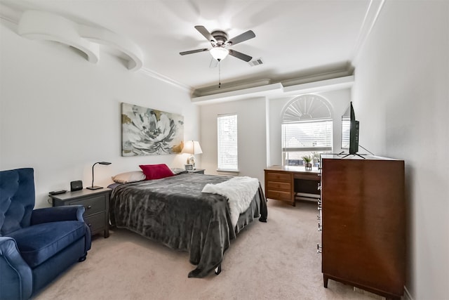 bedroom featuring ornamental molding, light colored carpet, ceiling fan, and visible vents