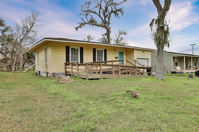 view of front of property with a deck and a front yard