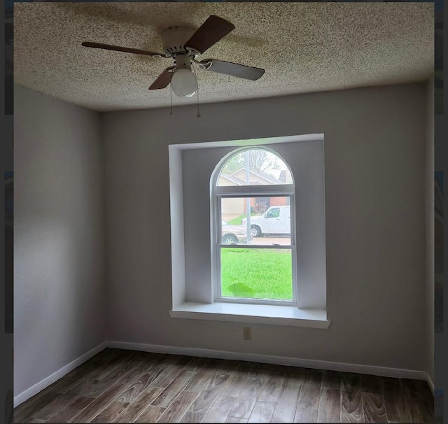 unfurnished room with hardwood / wood-style flooring, ceiling fan, and a textured ceiling