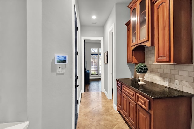 hallway with light tile patterned floors