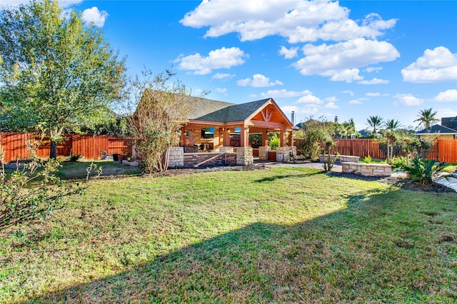 back of property with a yard and a patio