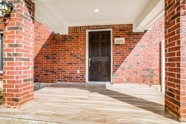 doorway to property featuring covered porch