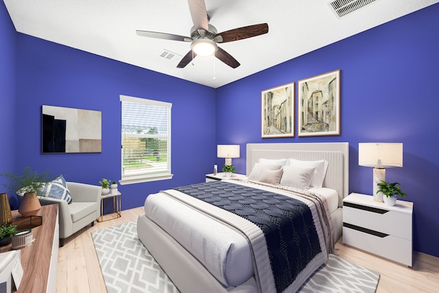 bedroom with light wood-type flooring and ceiling fan