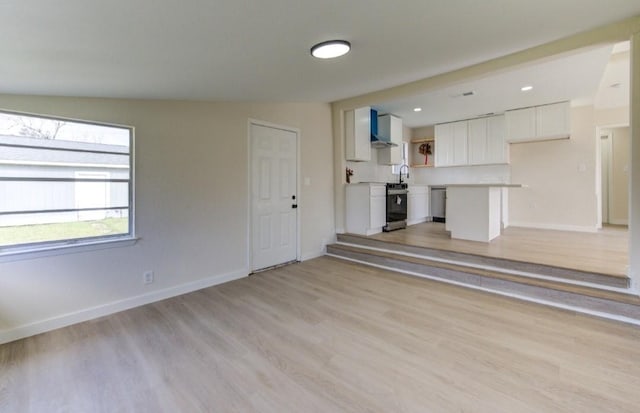 unfurnished living room featuring light hardwood / wood-style floors