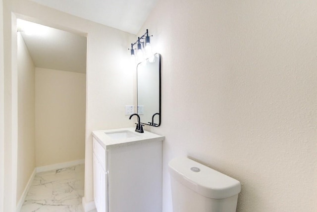 bathroom with toilet and vanity