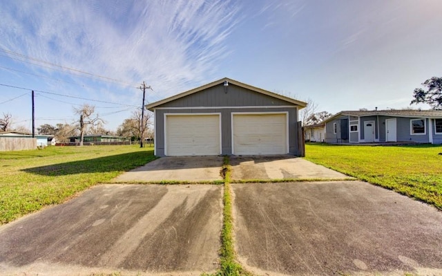 garage featuring a yard