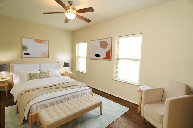 bedroom featuring ceiling fan and dark hardwood / wood-style floors