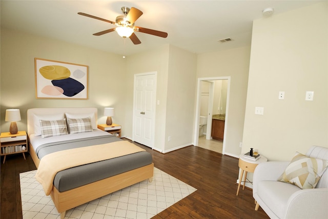 bedroom featuring connected bathroom, ceiling fan, and wood-type flooring