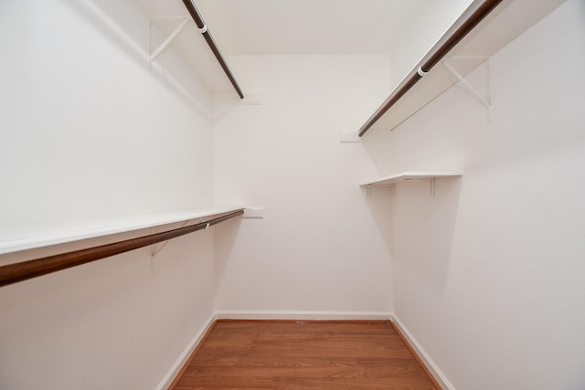 spacious closet featuring hardwood / wood-style floors