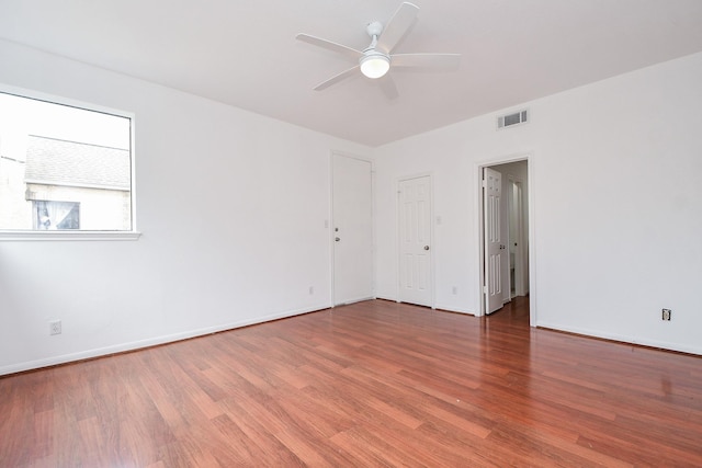 unfurnished room with ceiling fan and wood-type flooring