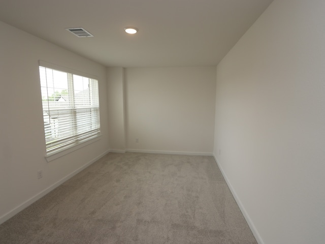 31907 Splendor Dr, Fulshear, TX 77441 - empty room featuring light colored carpet, baseboards, and recessed lighting