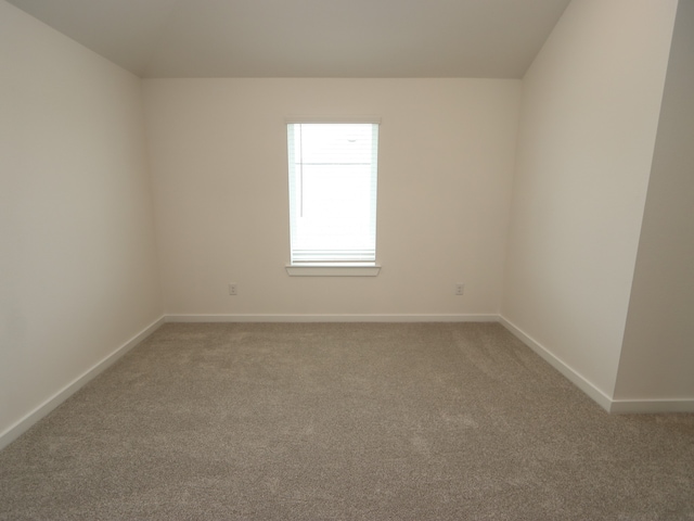 31907 Splendor Dr, Fulshear, TX 77441 - carpeted empty room featuring baseboards and lofted ceiling