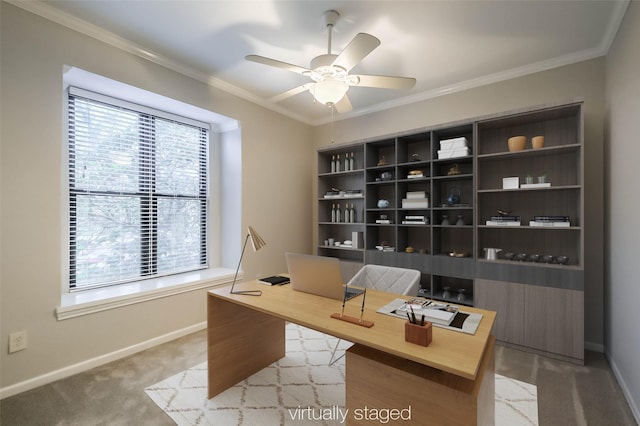 office featuring light carpet, baseboards, ornamental molding, and a ceiling fan