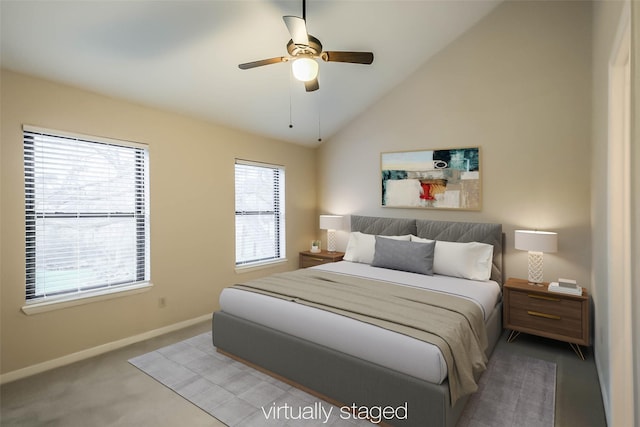 bedroom featuring carpet floors, baseboards, a ceiling fan, and lofted ceiling