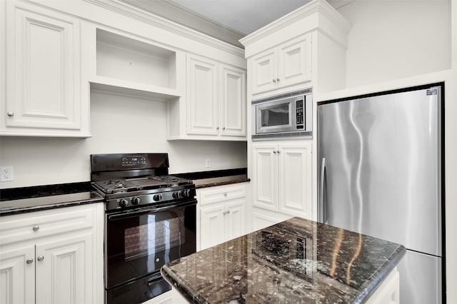 kitchen featuring open shelves, white cabinetry, dark stone countertops, and appliances with stainless steel finishes