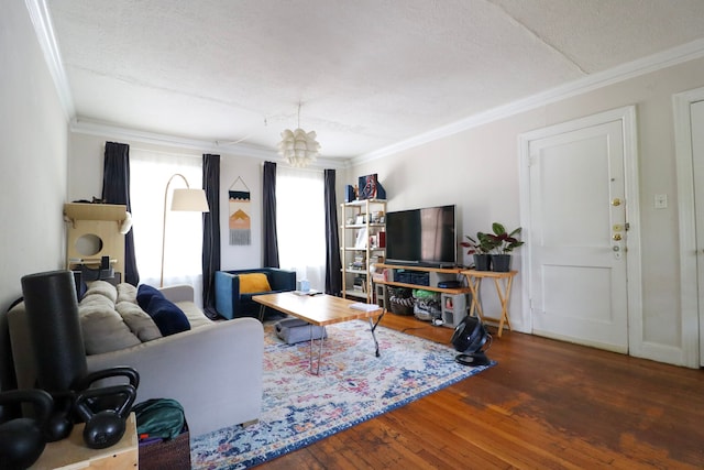 living area featuring dark wood-style floors, ornamental molding, and a textured ceiling