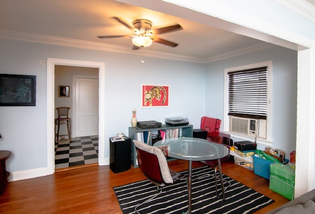 rec room with baseboards, ceiling fan, ornamental molding, and dark wood-type flooring