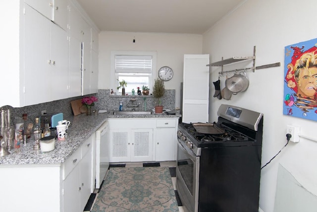 kitchen with open shelves, white cabinets, a sink, white dishwasher, and gas range