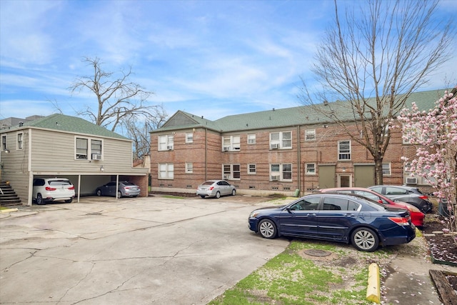 view of partially covered parking lot