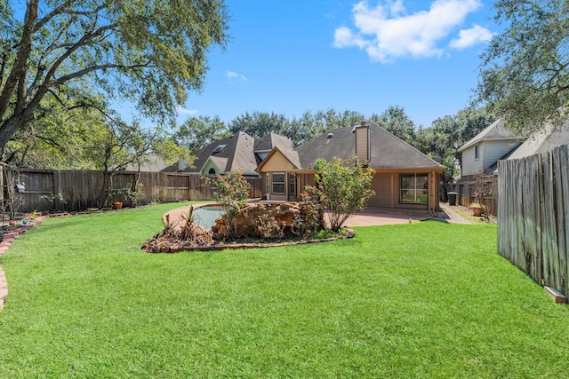 view of yard with a patio area and a pool