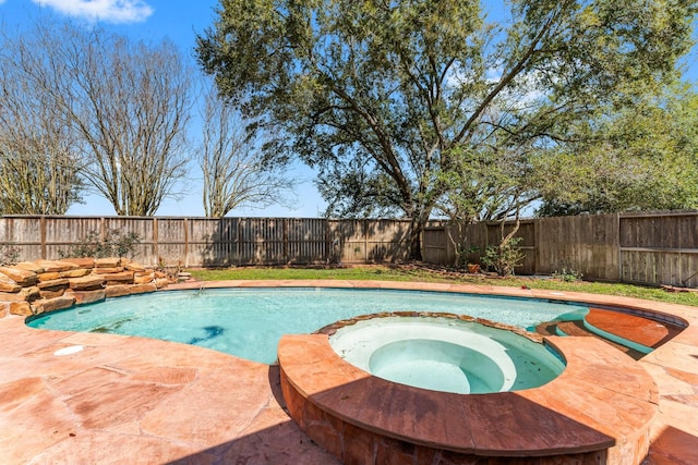 view of pool featuring an in ground hot tub