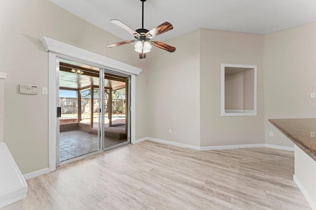 unfurnished dining area with light hardwood / wood-style floors and ceiling fan