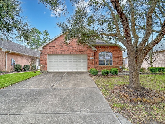 view of front of home featuring a garage and a front yard