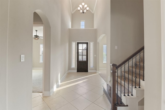 32007 Eagle Nest Ln, Conroe, TX 77385 - tiled foyer with arched walkways, high vaulted ceiling, and a wealth of natural light