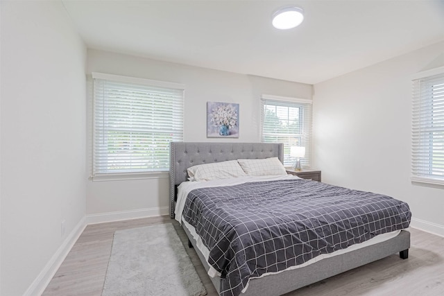 bedroom with hardwood / wood-style flooring