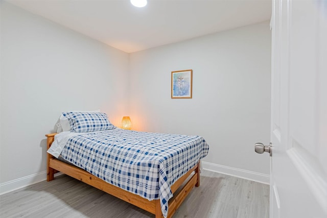 bedroom featuring hardwood / wood-style flooring