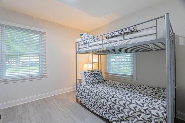 bedroom with hardwood / wood-style floors