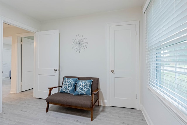 living area with light hardwood / wood-style flooring