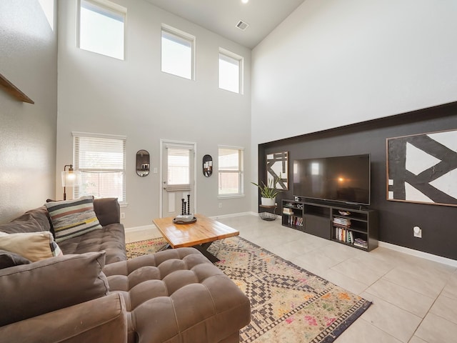 living room with a wealth of natural light and light tile patterned floors