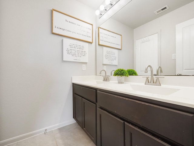 bathroom featuring tile patterned floors and vanity