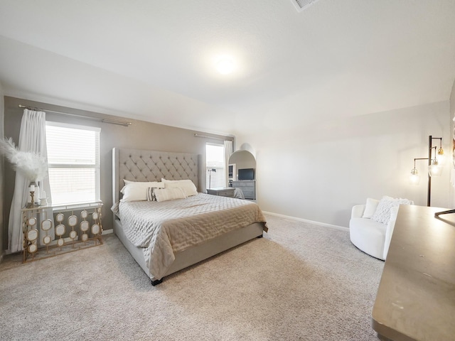 bedroom featuring light colored carpet