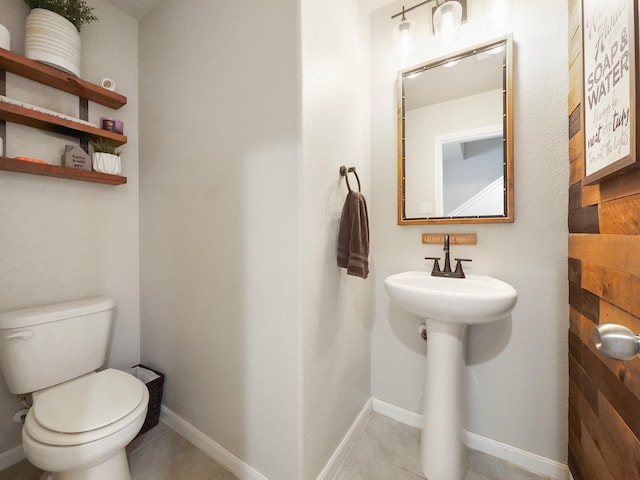 bathroom with tile patterned flooring and toilet