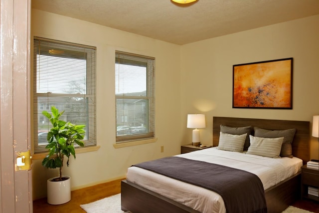 418 Garland Dr Unit 222, Lake Jackson, TX 77566 - bedroom featuring a textured ceiling and baseboards
