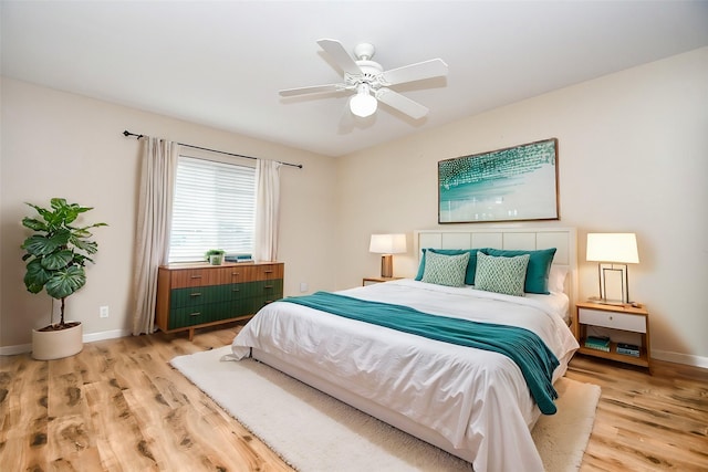 bedroom featuring ceiling fan and light hardwood / wood-style floors