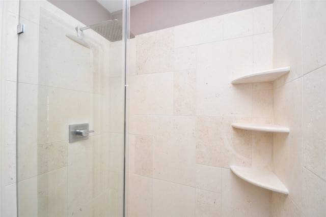 bathroom with tiled shower