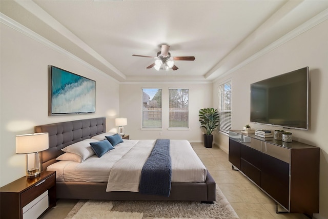 bedroom with light tile patterned floors, ceiling fan, baseboards, ornamental molding, and a raised ceiling