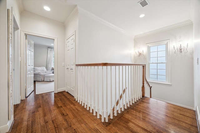 corridor with crown molding and dark hardwood / wood-style flooring