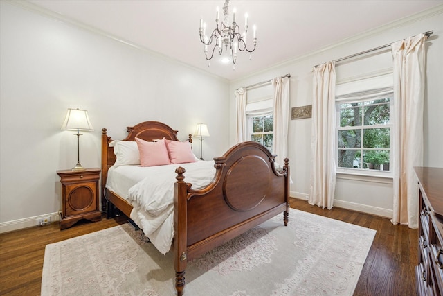 bedroom with crown molding, an inviting chandelier, and dark hardwood / wood-style flooring