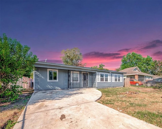 view of front of property with a lawn