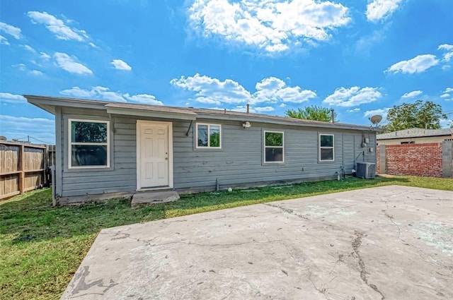 rear view of property featuring central AC and a patio area